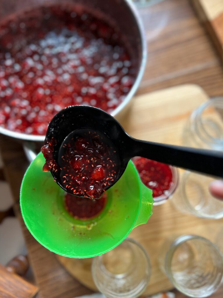 Ladle the Cherry Raspberry Gooseberry Jam in